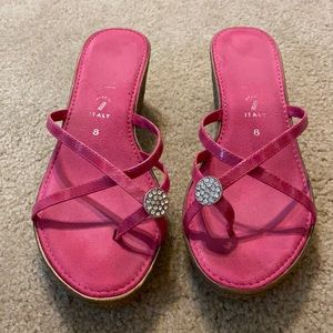 made in Italy strapped wedge sandals. Fuschia